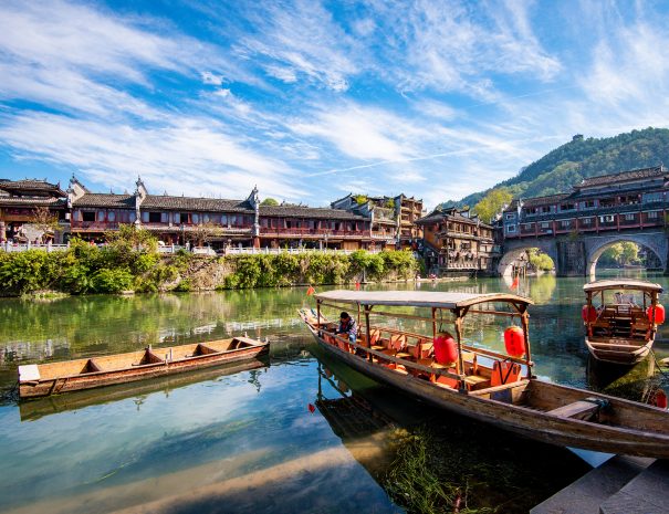 Fenghuang, China - November 2nd, 2019: Tourists walking along Phoenix Ancient Town (Fenghuang County). Awesome view of scenic old street. Fenghuang is a popular tourist destination of Asia.; Shutterstock ID 1660129789; purchase_order: -; job: -; Name of competition (if applicable): -; other: -