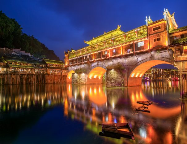 Hong bridge (Rainbow bridge) at night in Fenghuang old city ,Hunan Province, China; Shutterstock ID 1894924513; purchase_order: -; job: -; Name of competition (if applicable): -; other: -