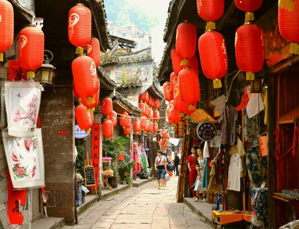 Fenghuang, China - May 15, 2017: The decoration of red umbrella on the streets of Fenghuang Ancient Town (Phoenix ancient town).; Shutterstock ID 777328129; purchase_order: -; job: -; client: -; other: -